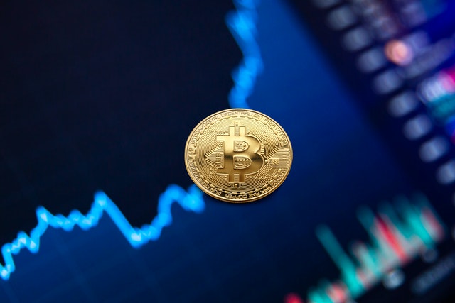 bitcoin coin over rising graph