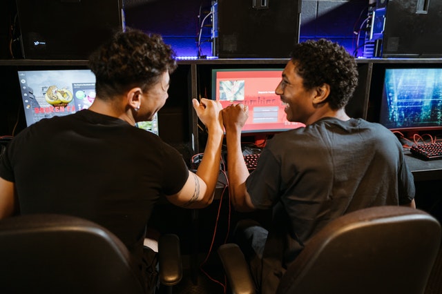 two gamers playing together